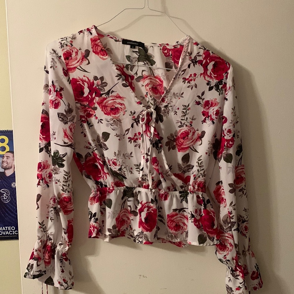 Floral peplum crossover top